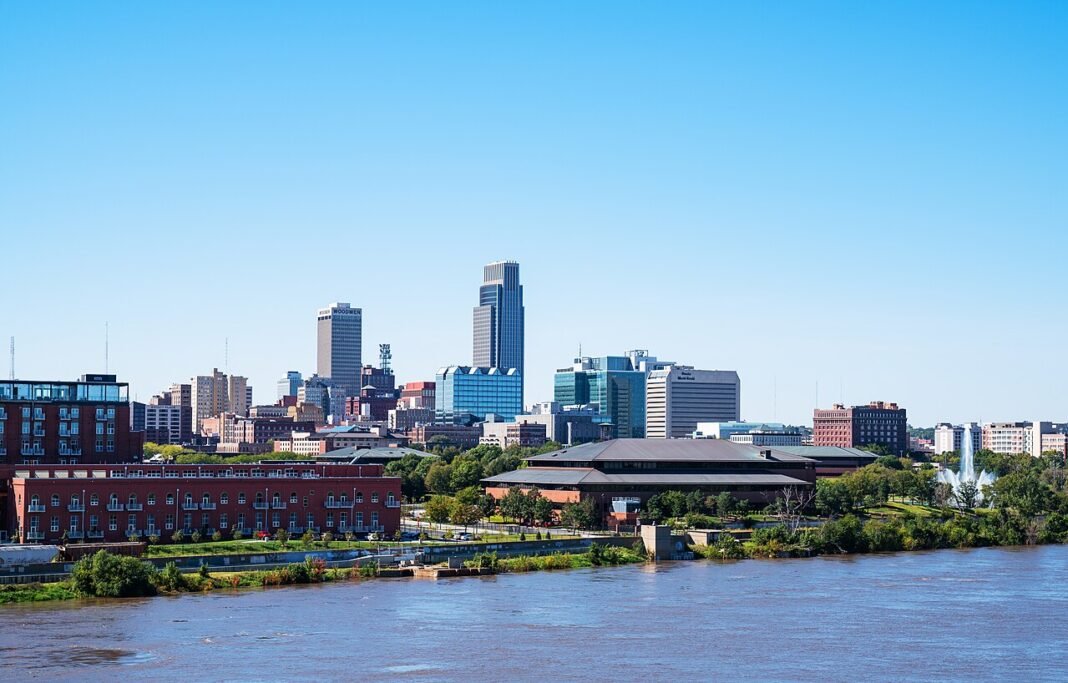 Moving to Nebraska in 2026: Complete Relocation Guide Omaha Nebraska downtown skyline reflected in the Missouri River, 2018