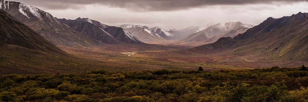 Cost of Living in Yukon 2026: Whitehorse Prices, Salaries, and What to Budget Tombstone Territorial Park dramatic mountain valley tundra autumn Yukon Territory Canada cost of living