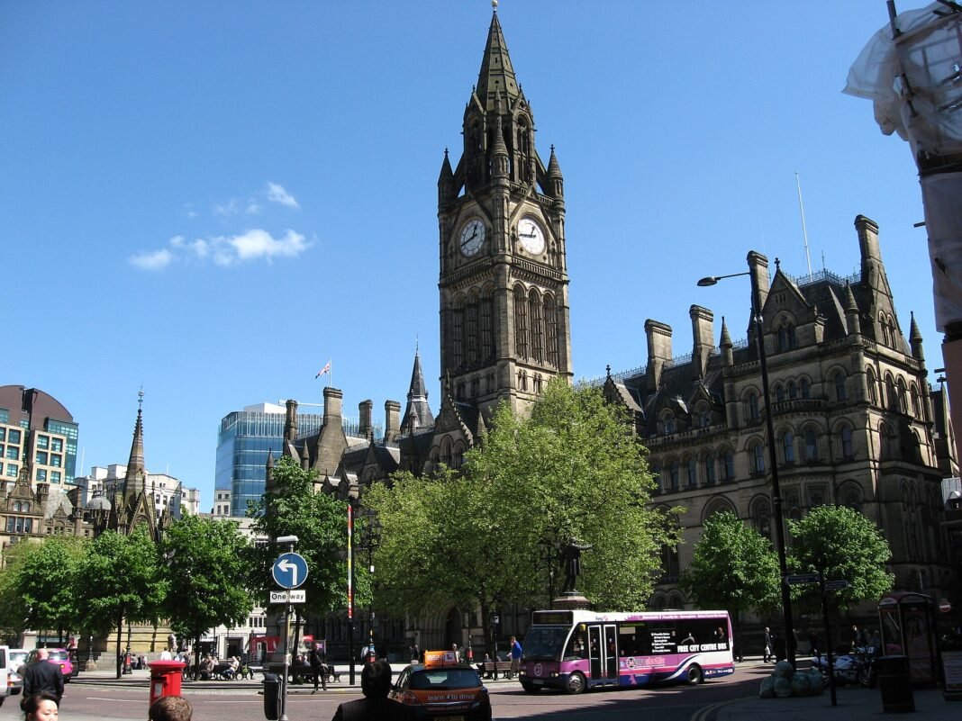Manchester and the North of England: A Travel Guide Manchester Town Hall and its clock tower on Albert Square in the city centre, England