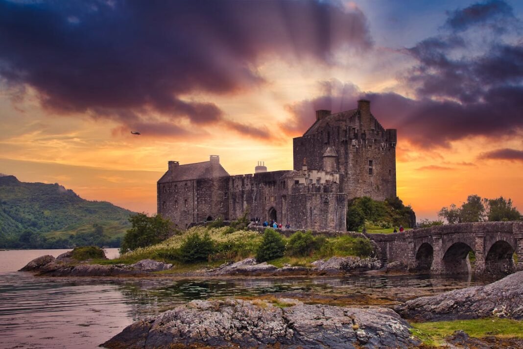 Scottish Highlands Road Trip: The Ultimate NC500 and Beyond Eilean Donan Castle Scottish Highlands Scotland UK medieval castle loch mountain landscape travel guide