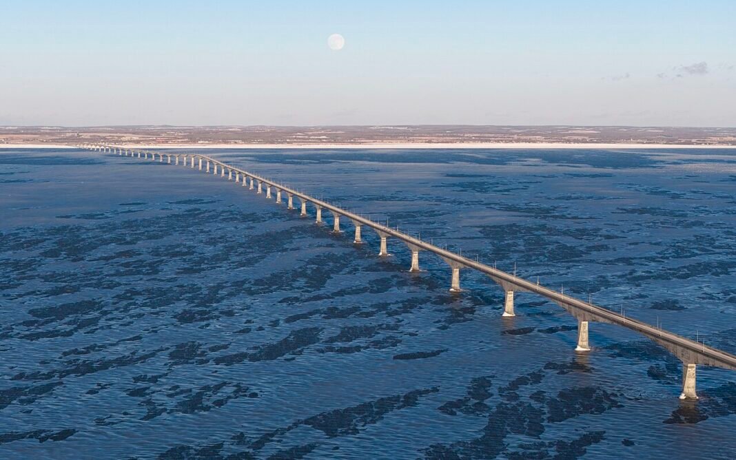 Best Places to Live in Prince Edward Island 2026: Charlottetown, Summerside, and the Island Communities Confederation Bridge aerial view connecting Prince Edward Island to New Brunswick Canada best places 2026