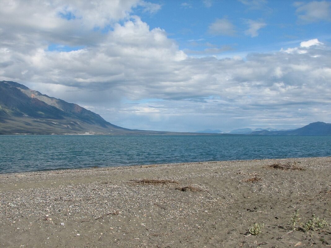 Moving to the Yukon 2026: Relocation Guide for Canada’s Last Frontier Kluane Lake turquoise water mountains Yukon Territory Canada relocation guide 2026