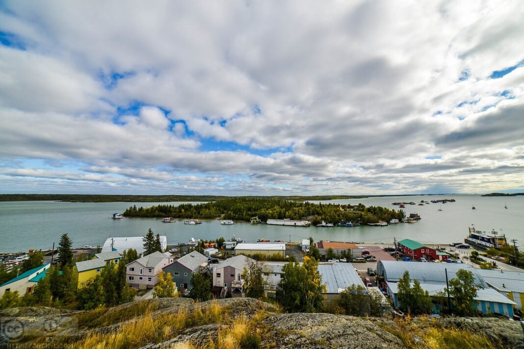 Best Cities and Towns in the Northwest Territories 2026: Yellowknife, Hay River, Inuvik Yellowknife Old Town heritage buildings houseboats and Back Bay Great Slave Lake Northwest Territories Canada