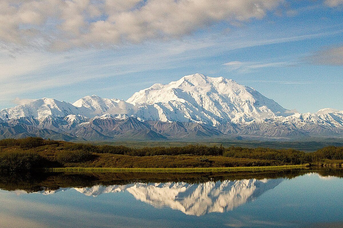 Cost of Living in Alaska 2026: The Real Price of America’s Last Frontier Wonder Lake reflecting Denali mountain at sunrise Denali National Park Alaska