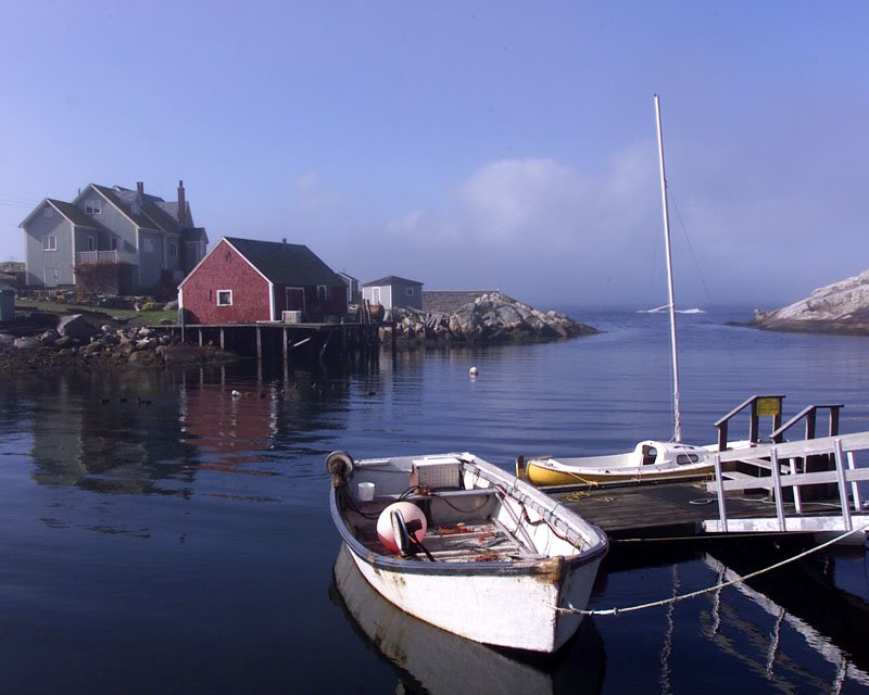 Cost of Living in Nova Scotia 2026: Halifax’s Value and the Atlantic Affordability Fishing boats anchored in a peaceful bay on the Nova Scotia Atlantic coast Canada