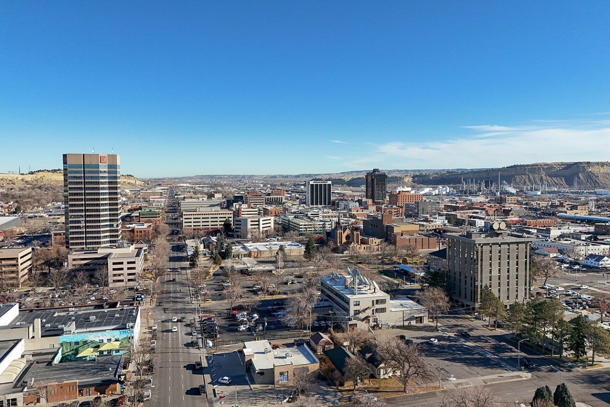 Cost of Living in Montana 2026: Bozeman Premium and Montana Rural Affordability Billings Montana skyline Rimrocks sandstone cliffs Big Sky Country