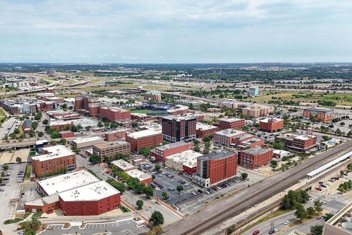 Oklahoma Travel Guide 2026: Red Rock Canyons, Native Heritage, and the Great Plains Bricktown Oklahoma City canal entertainment district aerial view