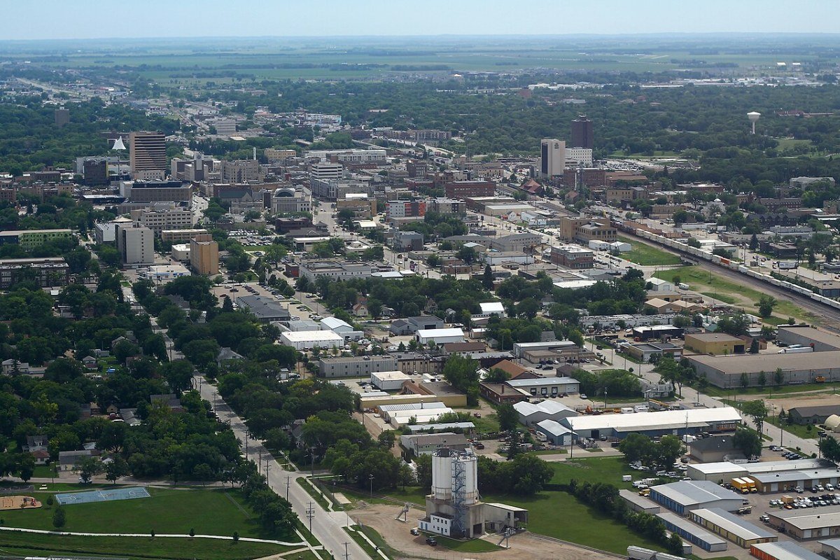 Cost of Living in North Dakota 2026: Prairie Affordability and the Oil Patch Premium Downtown Fargo North Dakota aerial view skyline Red River valley