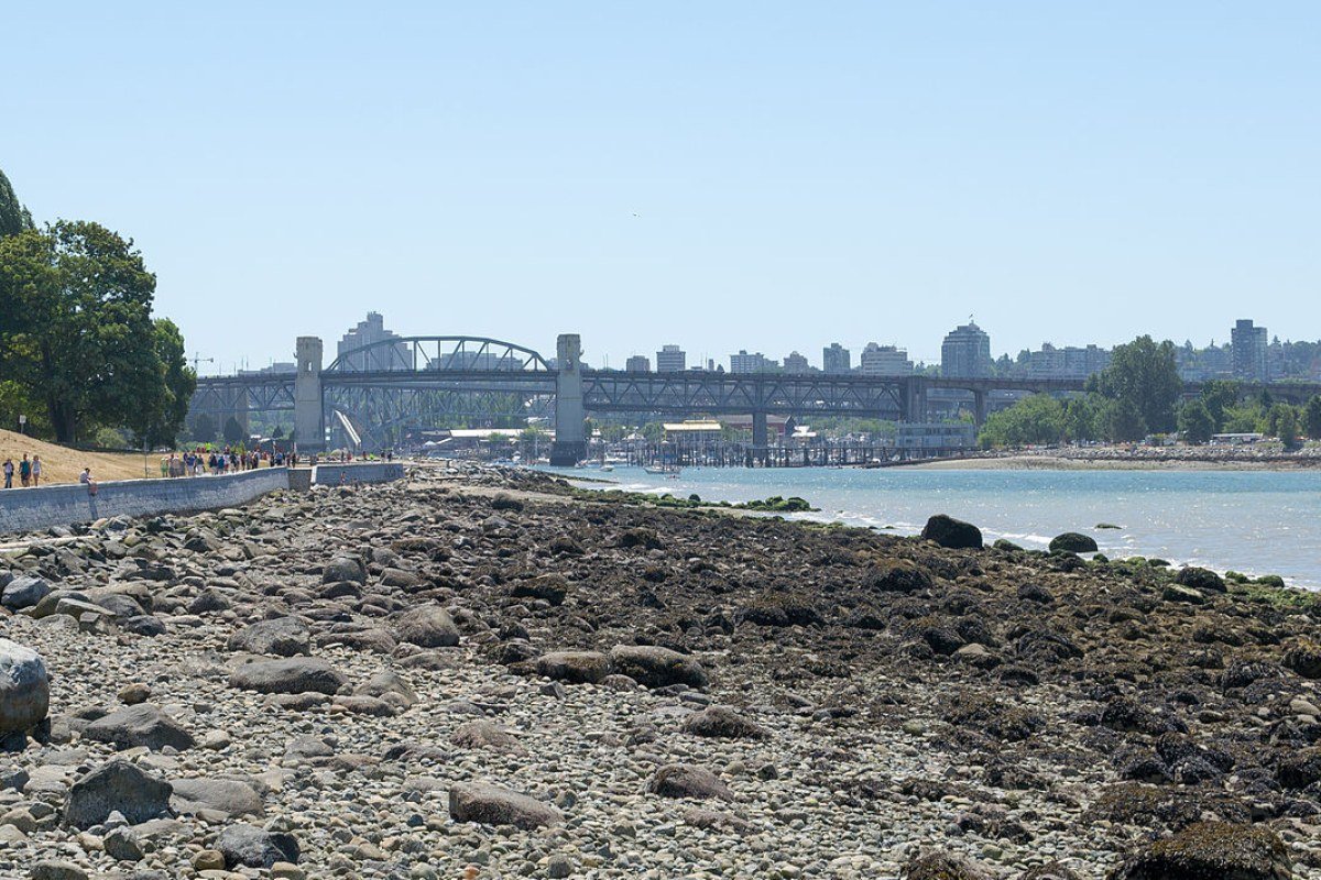 Moving to British Columbia in 2026: Complete Relocation Guide English Bay beach and Vancouver skyline at sunset British Columbia Canada
