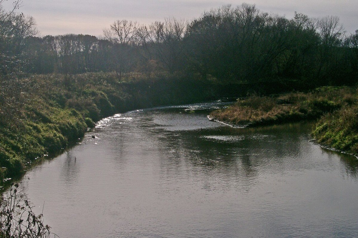 Moving to Iowa in 2026: Complete Relocation Guide Roseman Covered Bridge Madison County Iowa country road iconic landmark