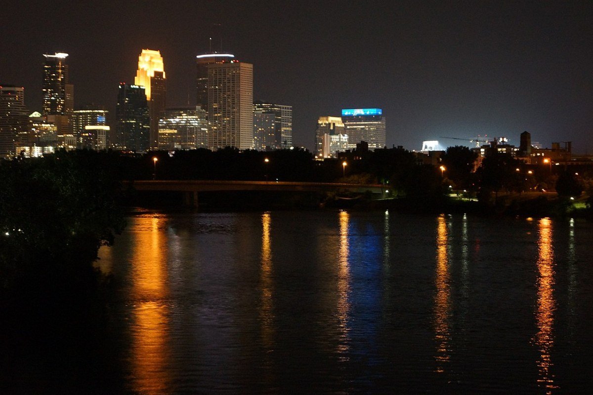 Cost of Living in Minnesota 2026: Twin Cities Value and Northern Minnesota Affordability Minneapolis skyline at night Minnesota Twin Cities downtown reflection