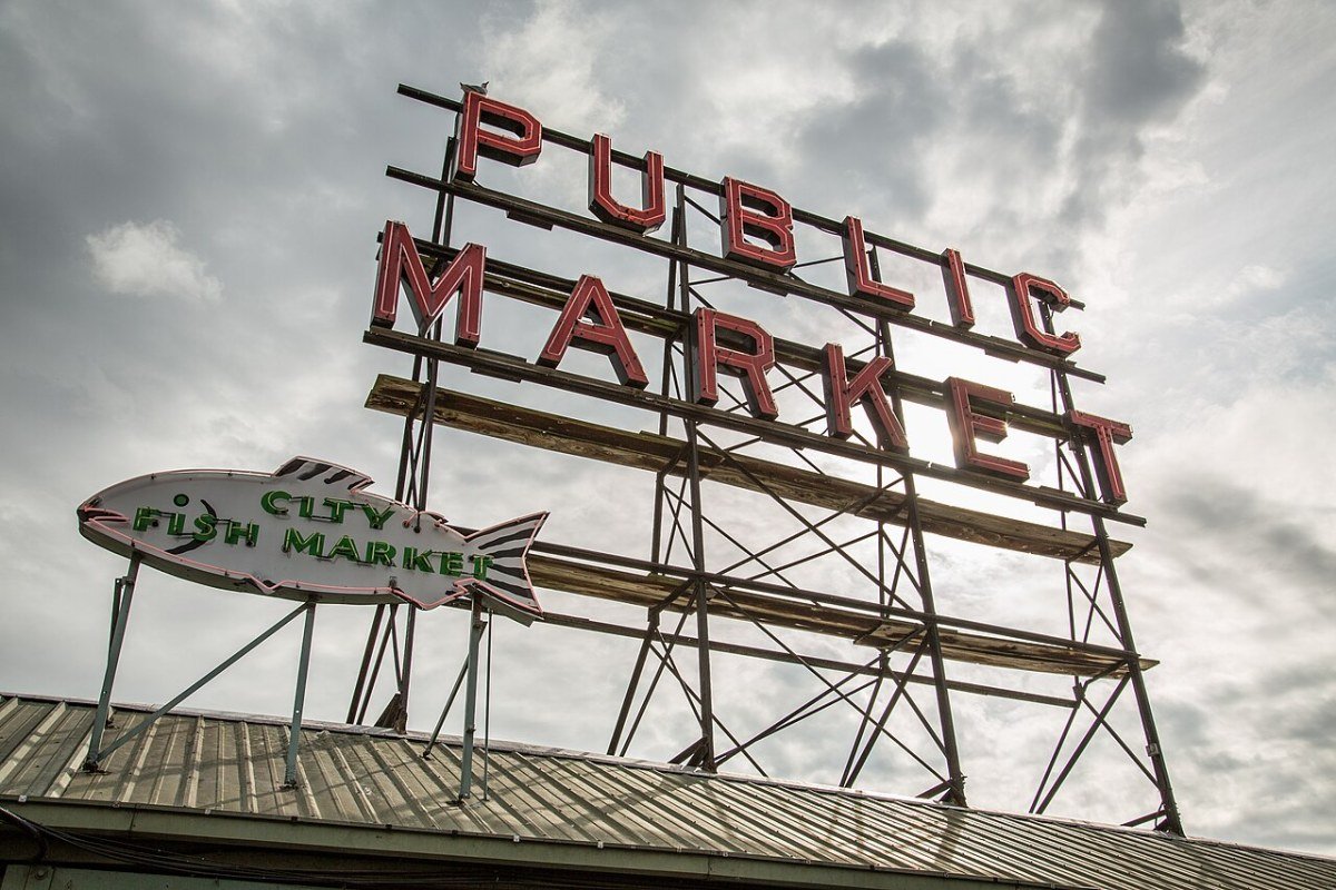 Washington State Travel Guide 2026: Olympic Rainforests, Cascades, and San Juan Islands Pike Place Market Seattle Washington vendors flowers fish market Public Market Center