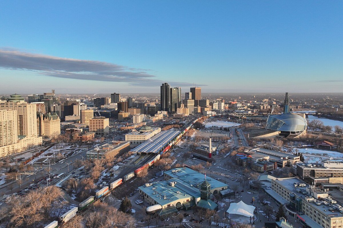 Manitoba Travel Guide 2026: Winnipeg, Churchill, and the Prairie Wilderness Winnipeg city skyline along the Red River Manitoba Canada