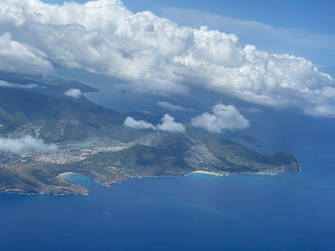 Best Places to Live in Hawaii 2026: Island-by-Island Guide Aerial view of southeast Oahu Hawaii showing Hawaii Kai residential neighborhoods Koko Crater and Hanauma Bay along the Pacific coast