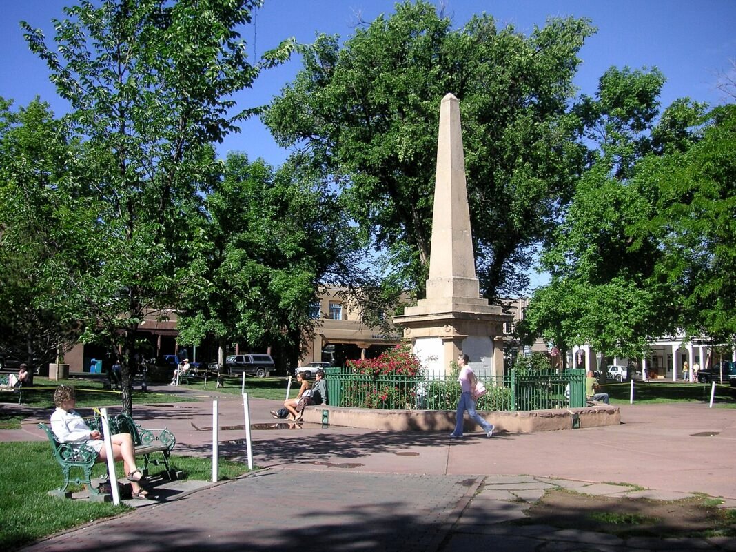 Cost of Living in New Mexico 2026: Affordability, Sun, and the Santa Fe Premium Santa Fe Plaza historic adobe architecture downtown New Mexico cost of living 2026