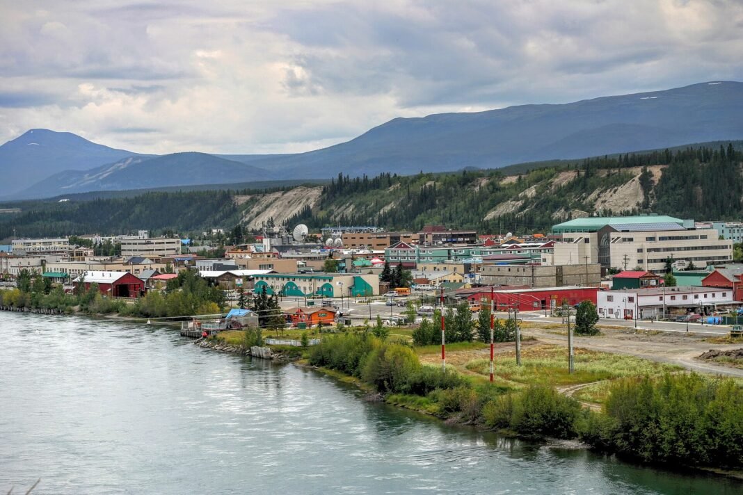 Best Cities and Towns in the Yukon 2026: Whitehorse, Dawson City, Watson Lake Downtown Whitehorse along the Yukon River with surrounding mountains, the modern capital of the Yukon, Canada