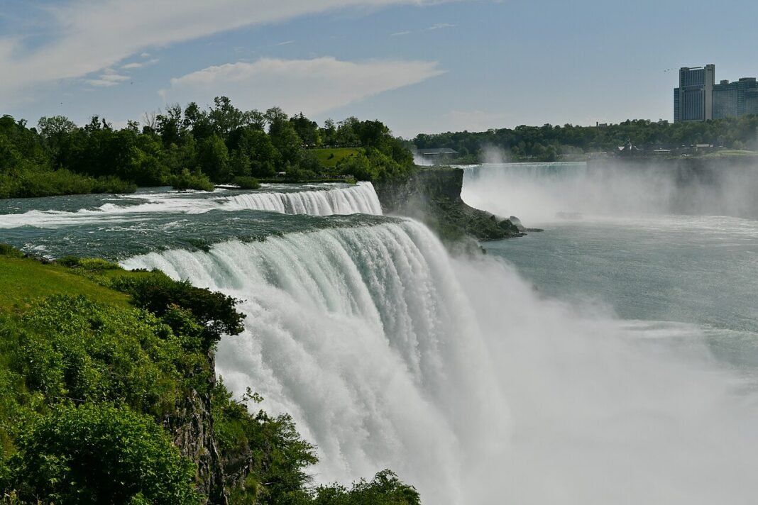 Moving to New York in 2026: Complete Relocation Guide Niagara Falls viewed from New York side with American Falls and Horseshoe Falls