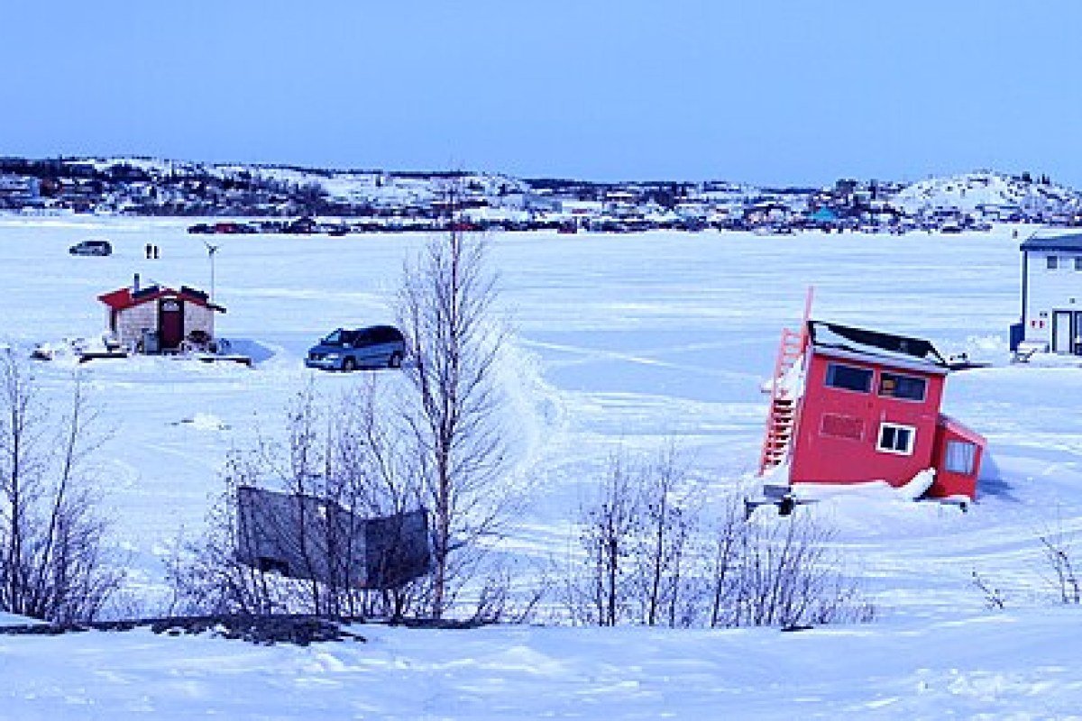 Northwest Territories Travel Guide 2026: Yellowknife, Aurora Borealis, and the Wilderness North Houseboats frozen in ice on Great Slave Lake Yellowknife Northwest Territories Canada