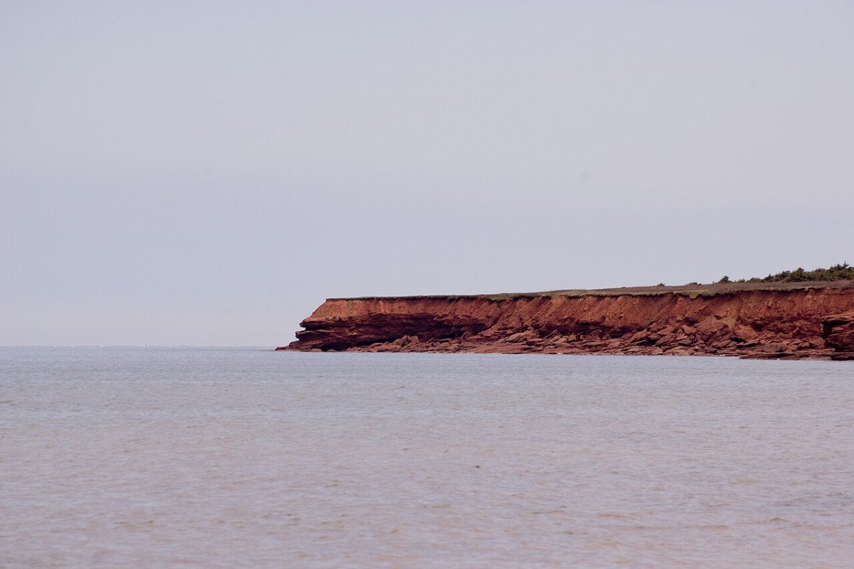Outdoor Activities in Prince Edward Island 2026: Red Sand Beaches, Cycling, and the Gentle Island Red sandstone cliffs at Cavendish Beach Prince Edward Island Canada