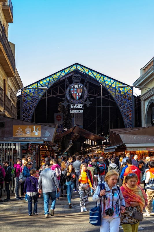 How to Avoid Tourist Traps: Travel Smarter in Every Destination Crowded La Boqueria market Barcelona Spain famous tourist attraction street market