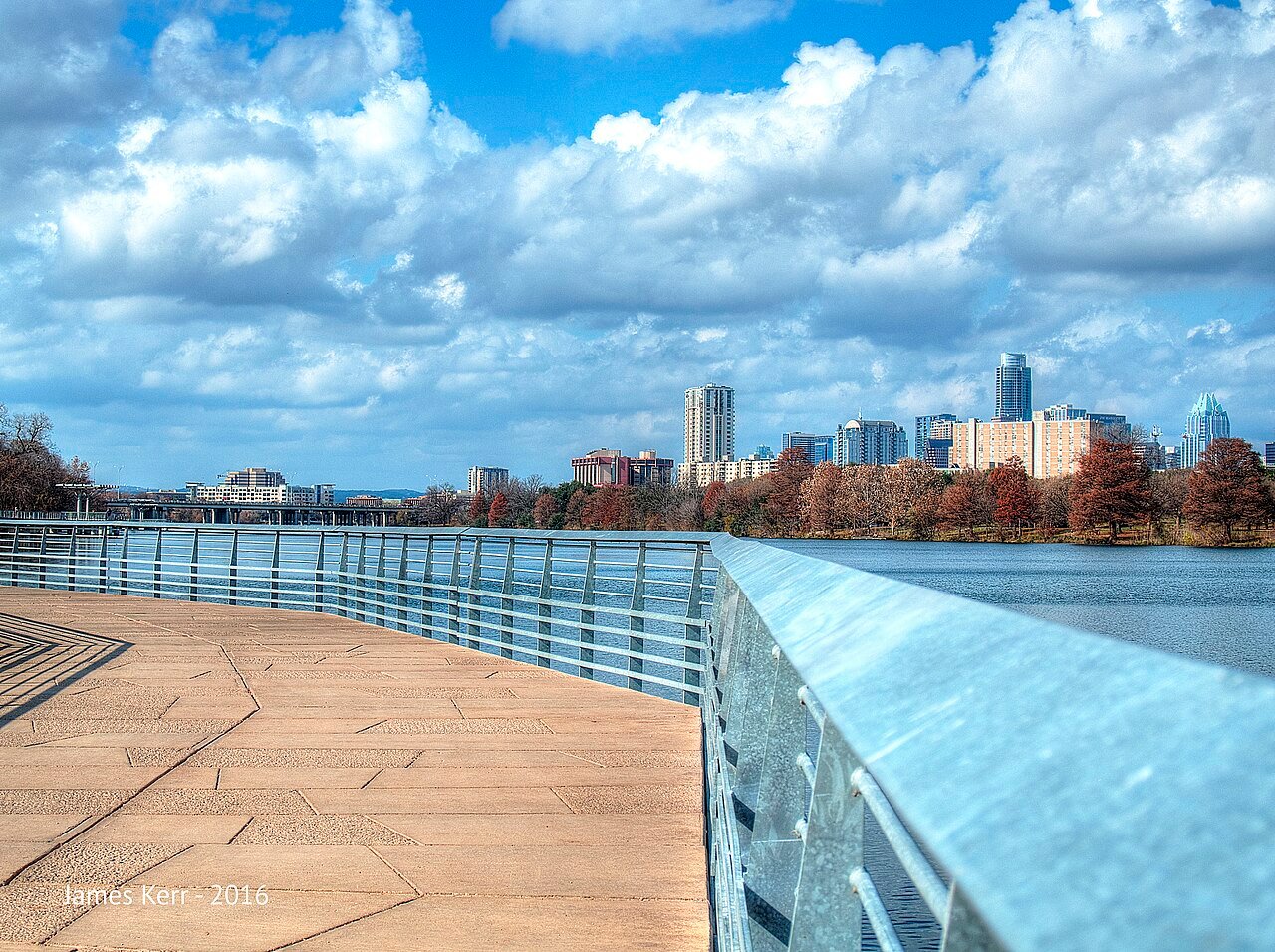 Austin Texas downtown skyline evening Colorado River Ladybird Lake bridges lights tech capital