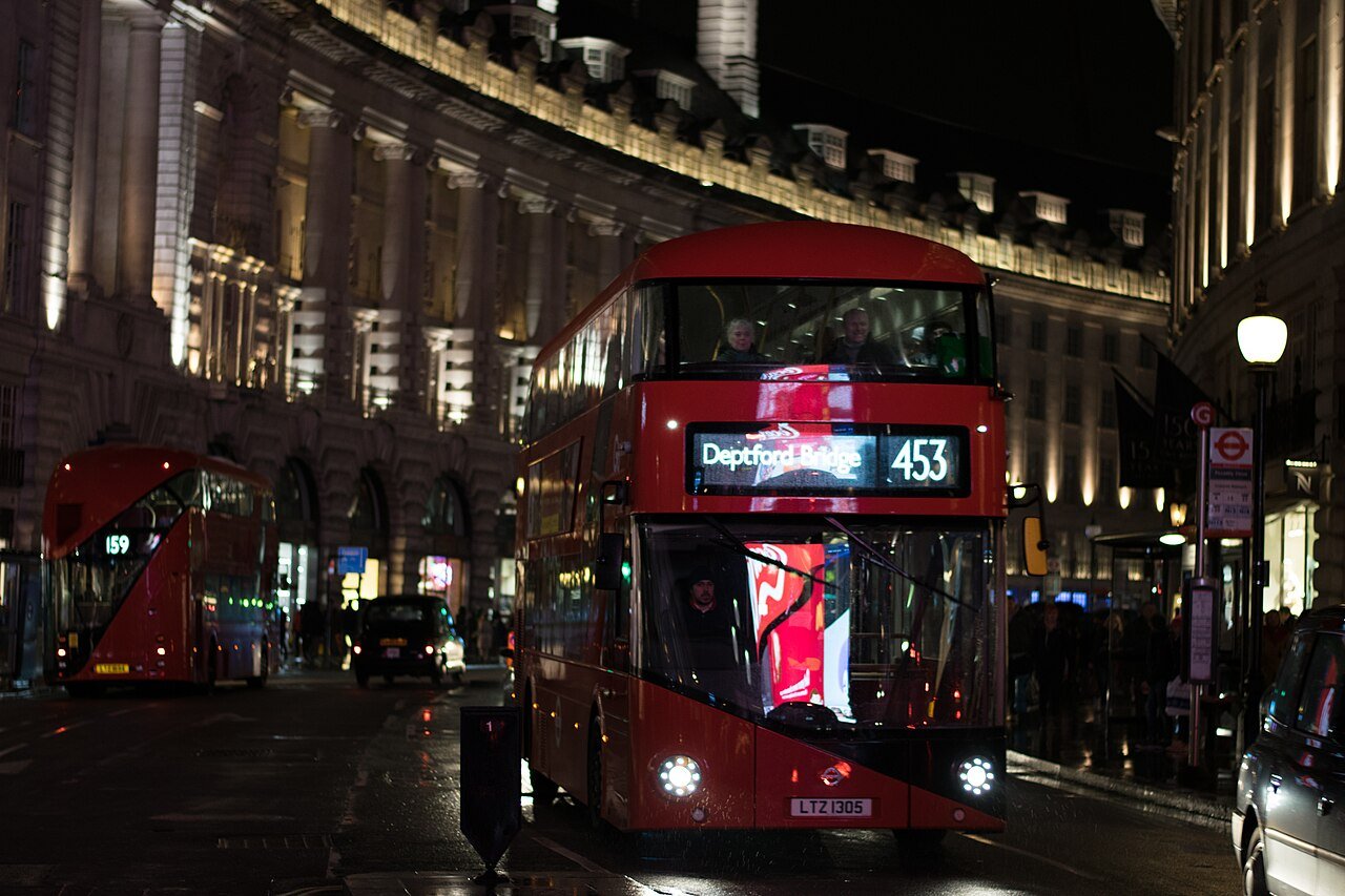 London red double-decker bus on the street — the iconic symbol of British public transport, still one of the best ways to see central London
