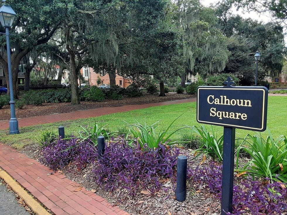 Moving to Georgia in 2026: The Complete Relocation Guide Calhoun Square Savannah Georgia historic Victorian homes tree-lined square