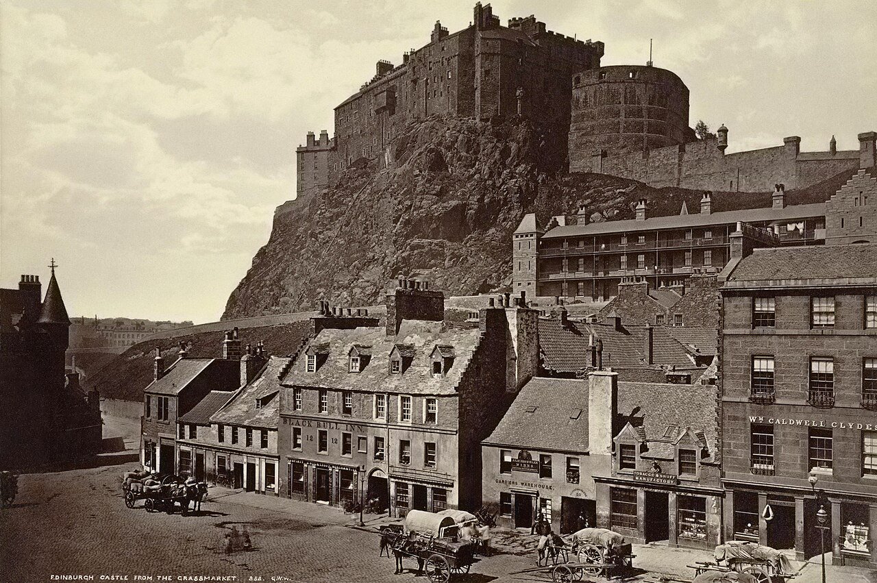 Edinburgh Castle Scotland seen from Princes Mall — the medieval fortress perched on volcanic rock dominates the city skyline
