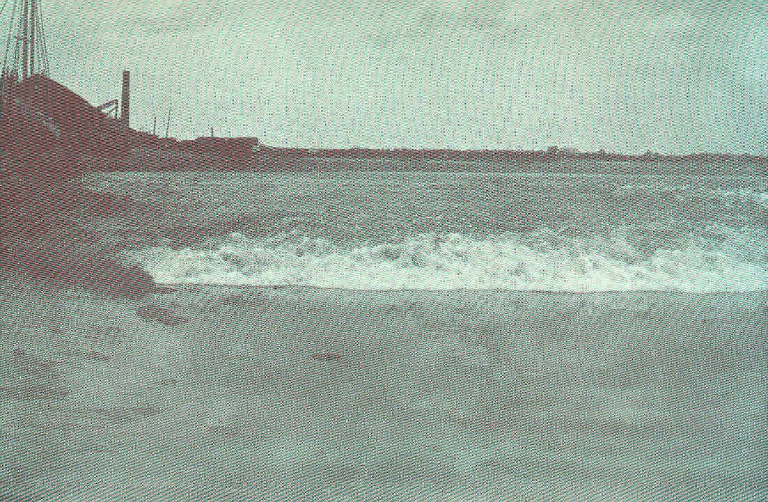 The Bay of Fundy tidal rush near Moncton New Brunswick — the world's highest tidal range, creating a natural phenomenon visible nowhere else on earth