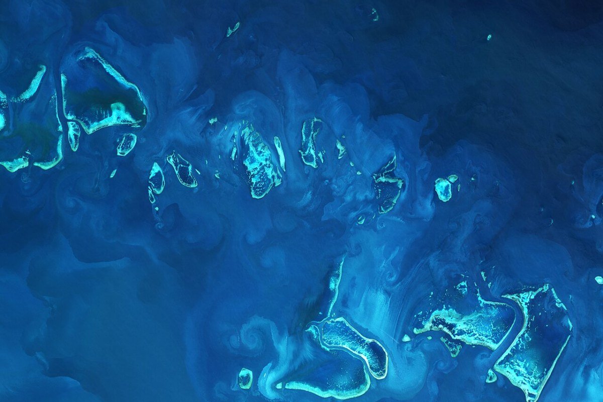 Great Barrier Reef Guide: Snorkeling, Diving, and Responsible Visiting Aerial view of coral reefs and turquoise waters Great Barrier Reef Queensland Australia