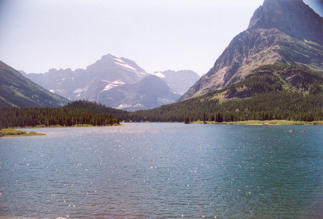 Lake Sherburne in Glacier National Park, Montana — pristine wilderness reflecting the park's dramatic mountain peaks