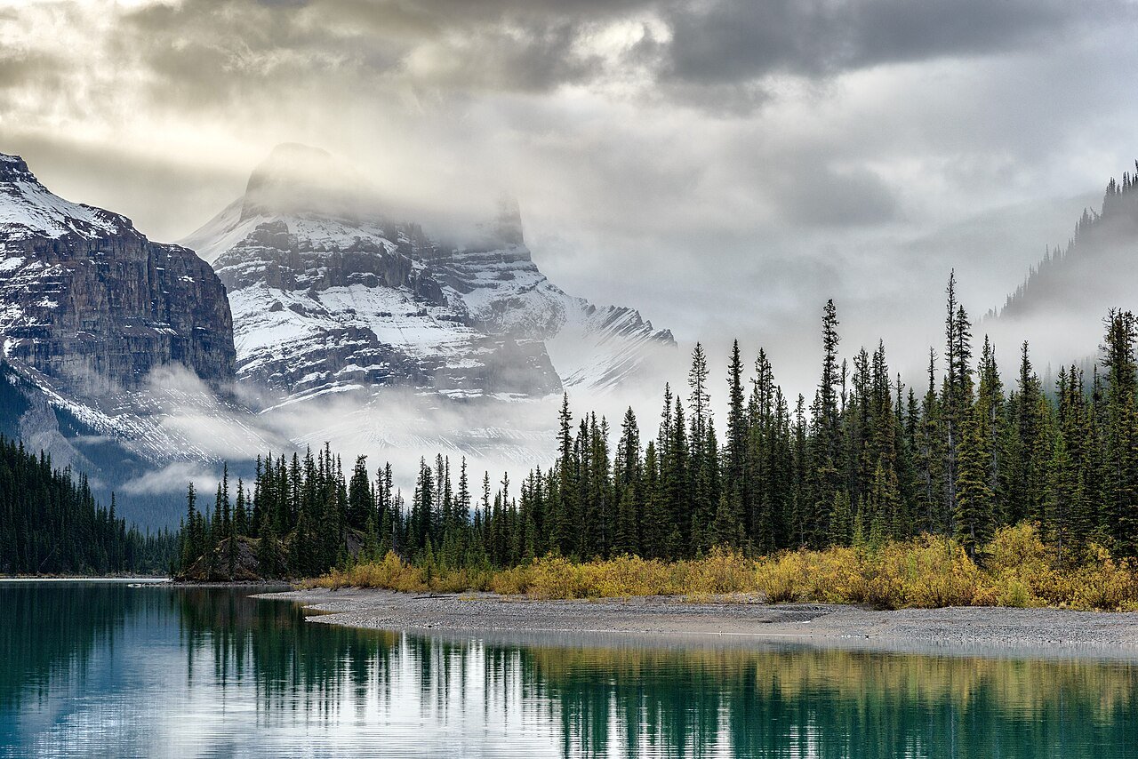 Sunrise at Maligne Lake Jasper National Park with Spirit Island and the surrounding peaks reflected in the turquoise glacial lake