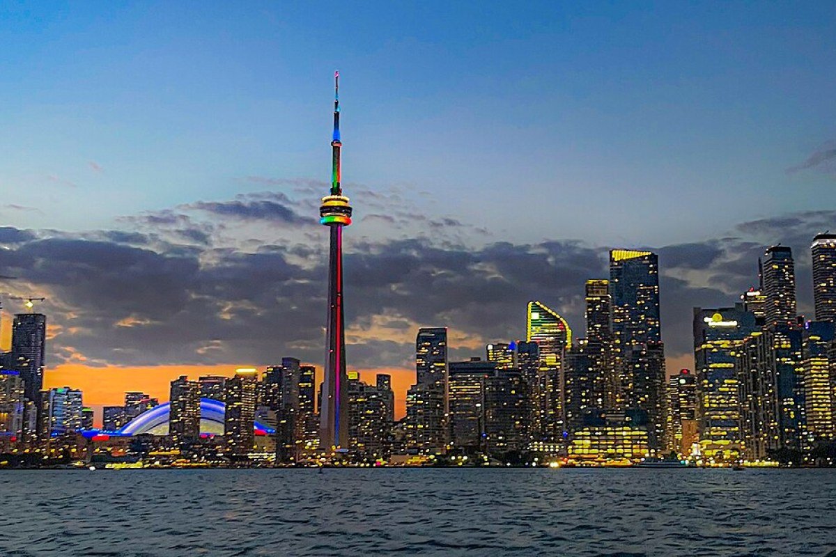 Toronto City Guide: Canada’s Most Diverse Metropolis Toronto skyline reflecting in Lake Ontario at night Ontario Canada