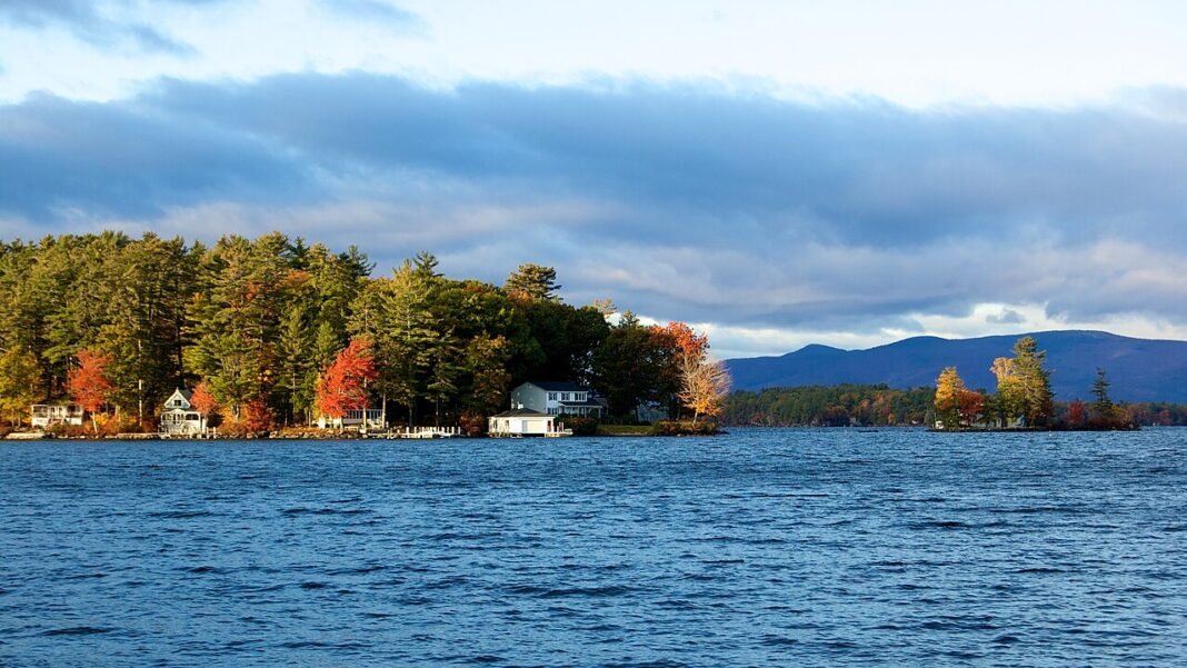 Moving to New Hampshire in 2026: Complete Relocation Guide Lake Winnipesaukee summer New Hampshire mountains lake district relocation guide 2026