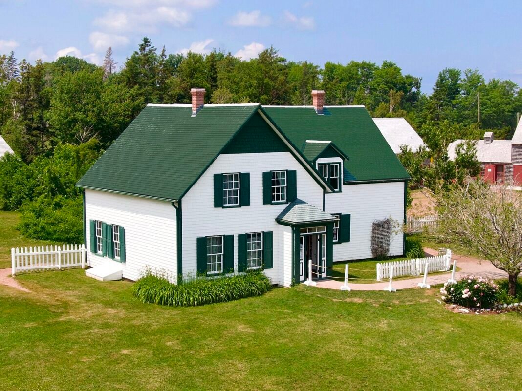 Prince Edward Island Travel Guide 2026: Red Sand Beaches, Anne of Green Gables, and the Gentle Island Green Gables Heritage Place iconic white house green roof summer Prince Edward Island PEI