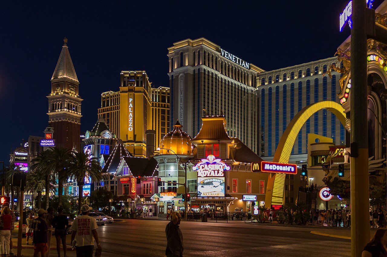 Las Vegas Strip street scene Nevada at night casinos neon pedestrians Venetian tower