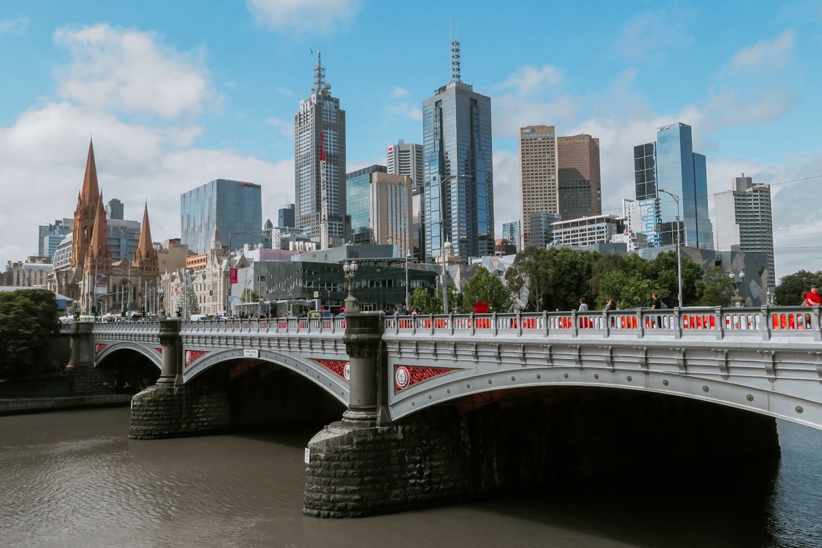 Melbourne Australia Princes Bridge Yarra River CBD skyline St Paul Cathedral Flinders Street