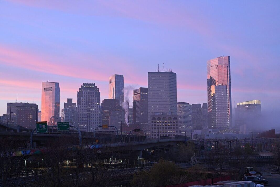Moving to Massachusetts in 2026: Complete Relocation Guide Boston skyline at sunset from West Broadway Massachusetts downtown I-93 South Station relocation
