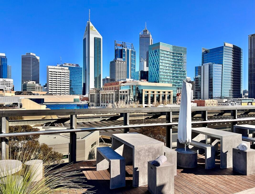 Best Places to Live in Western Australia 2026: Perth Suburbs, Fremantle, and the South West Perth CBD skyline reflected in Swan River, Western Australia, 2022