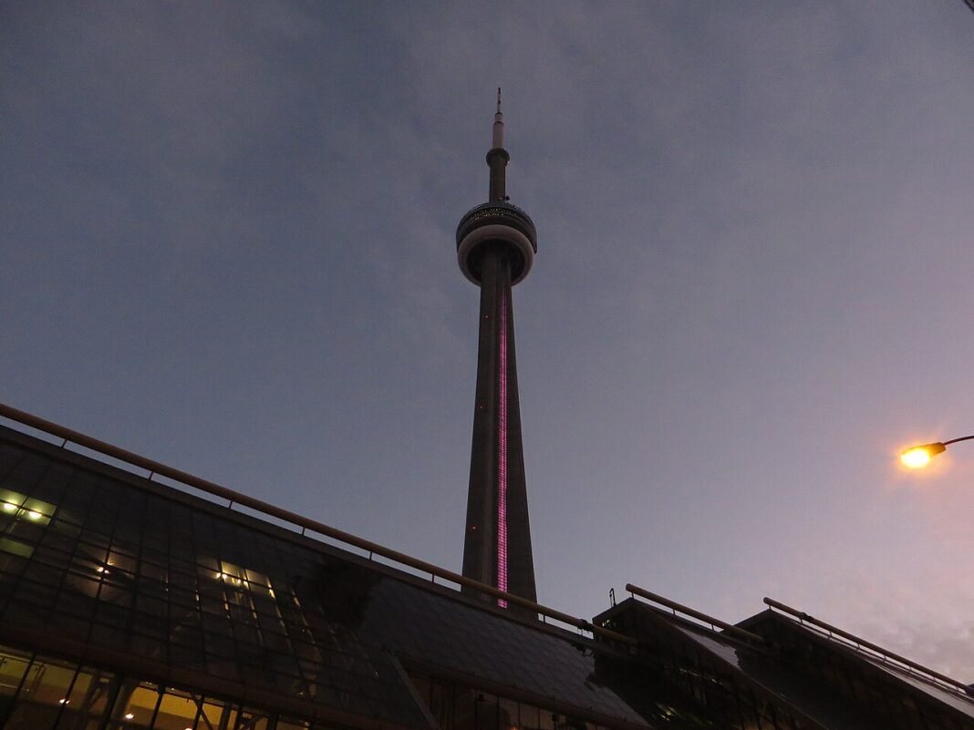 Best Places to Live in Ontario 2026: Toronto Neighbourhoods, Ottawa, and the Small Cities CN Tower rising above Toronto Ontario skyline, Canada