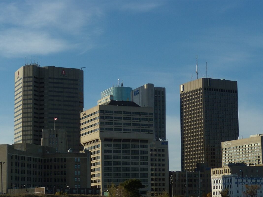 Best Places to Live in Manitoba 2026: Winnipeg Neighbourhoods and Regional Communities Cluster of buildings in downtown Winnipeg, Manitoba near Portage and Main