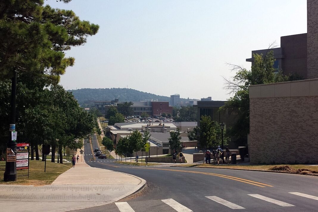 Best Cities to Live in Arkansas in 2026: Fayetteville, Bentonville and More Fayetteville, Arkansas skyline viewed from McIlroy Hill