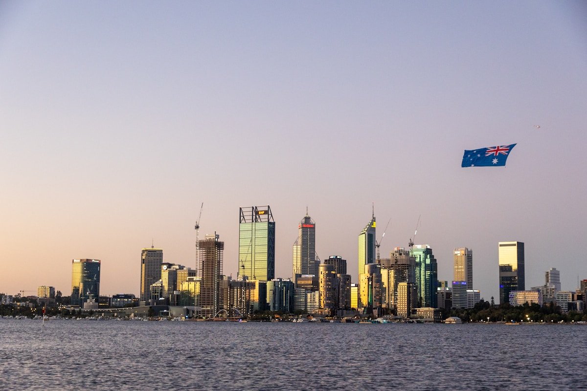 Perth Western Australia CBD skyline Swan River sunset Australian flag Elizabeth Quay