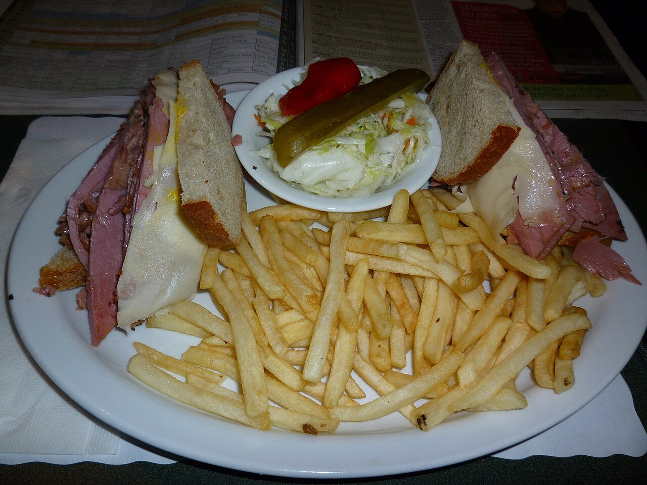 Montreal smoked meat sandwich on rye bread — the defining dish of Montreal's Jewish deli tradition, served at Schwartz's Hebrew Delicatessen on Boulevard Saint-Laurent