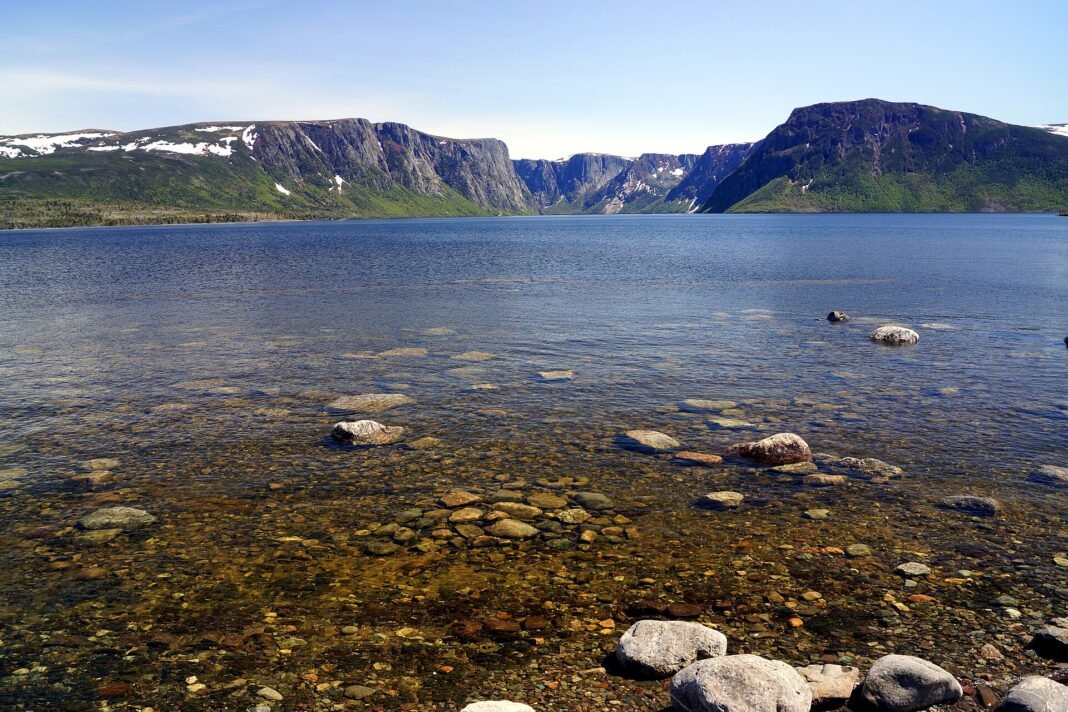 Newfoundland and Labrador Travel Guide 2026: St. John’s, Gros Morne, and the Edge of the World Western Brook Pond landlocked fjord and Long Range Mountains in Gros Morne National Park Newfoundland Canada