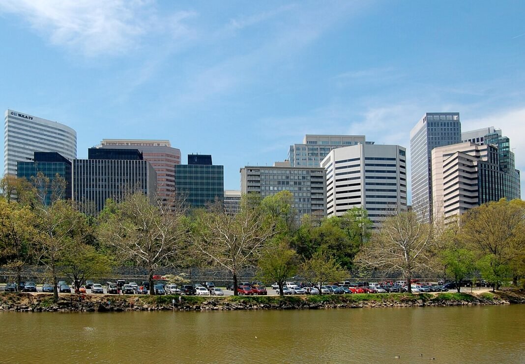 Cost of Living in Virginia 2026: DC Suburbs Premium vs. Affordable Interior Rosslyn Arlington Virginia skyline of office high-rises above the Potomac, Northern Virginia federal employment corridor
