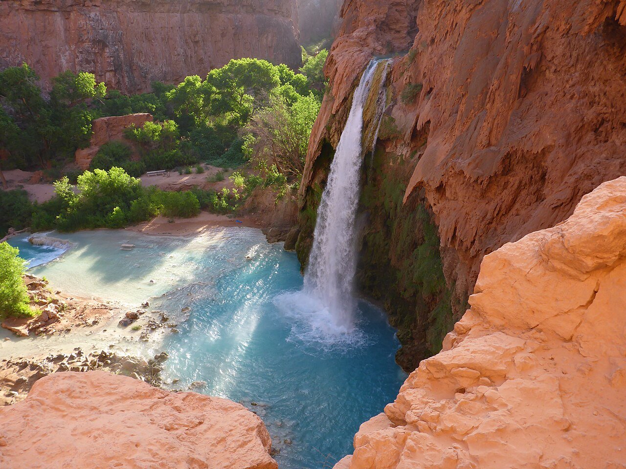Havasu Falls turquoise waterfall pouring over red sandstone cliffs on Havasupai tribal land in the Grand Canyon Arizona