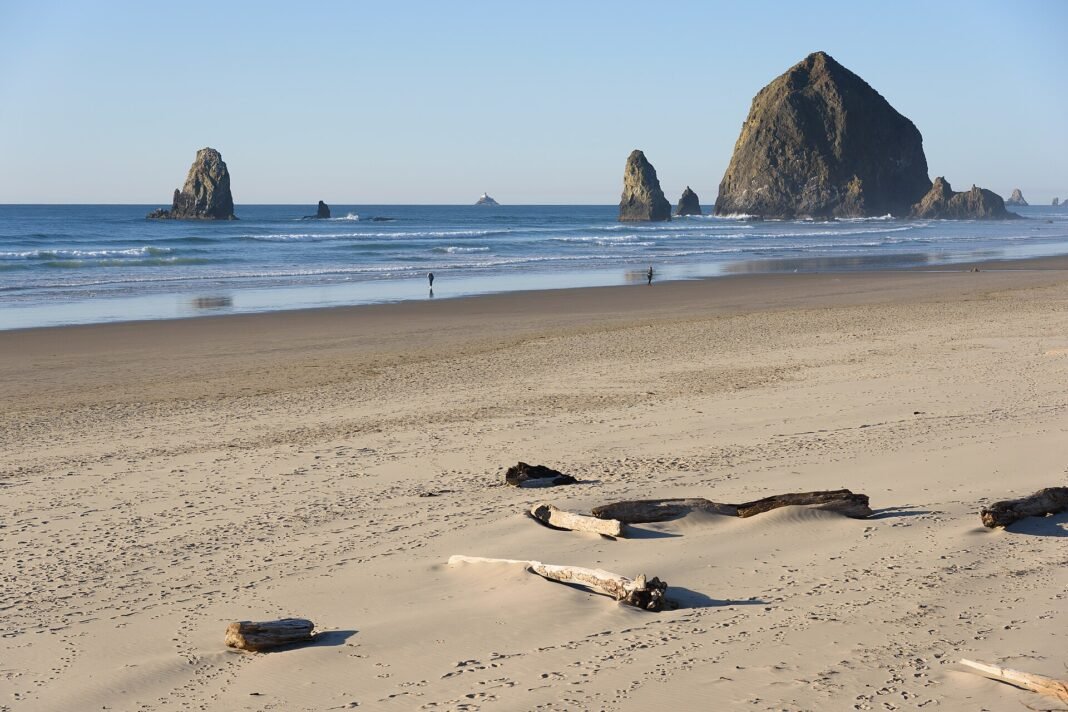 Outdoor Activities in Oregon 2026: Cascades, Coast, and High Desert Haystack Rock and sea stacks at Cannon Beach on the northern Oregon coast at low tide