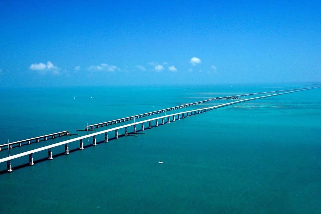 Best Places to Visit in Florida: Beaches, Everglades, Keys, and More Aerial view of the Seven Mile Bridge over turquoise water in the Florida Keys