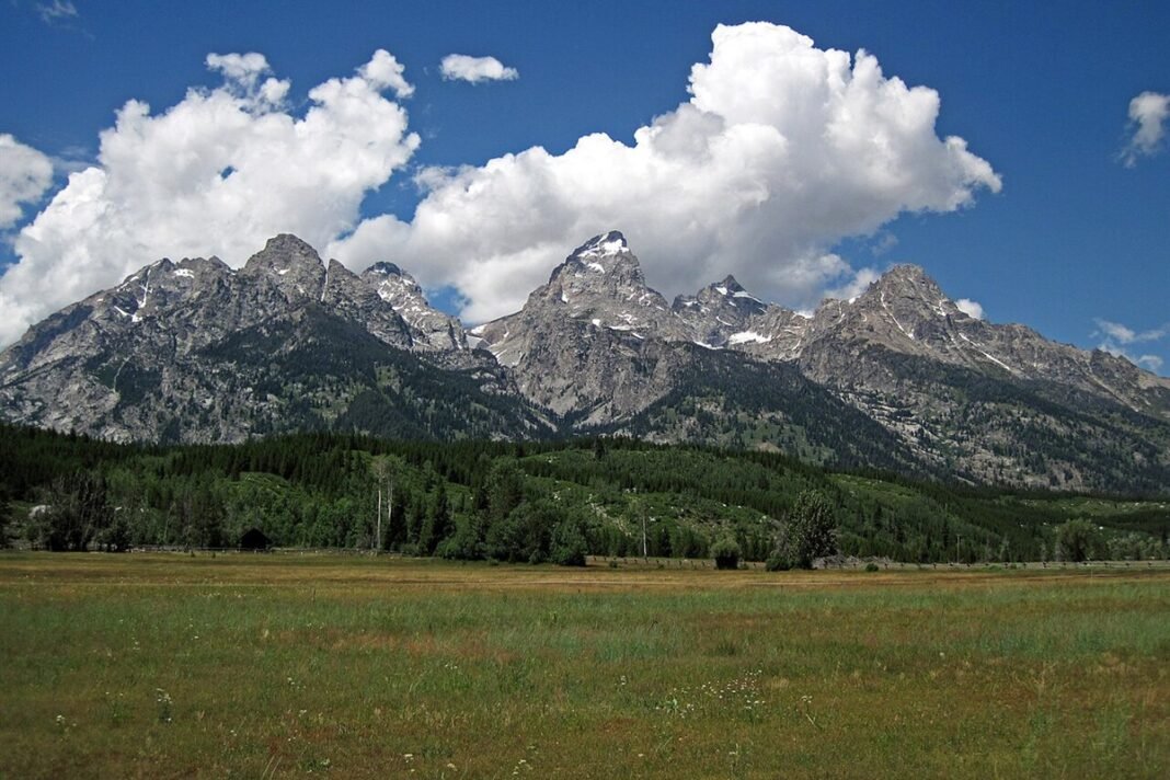Cost of Living in Wyoming 2026: Tax-Free Energy State vs. Jackson Hole’s Stratosphere Teton Range and Jackson Hole valley meadow Grand Teton National Park Wyoming